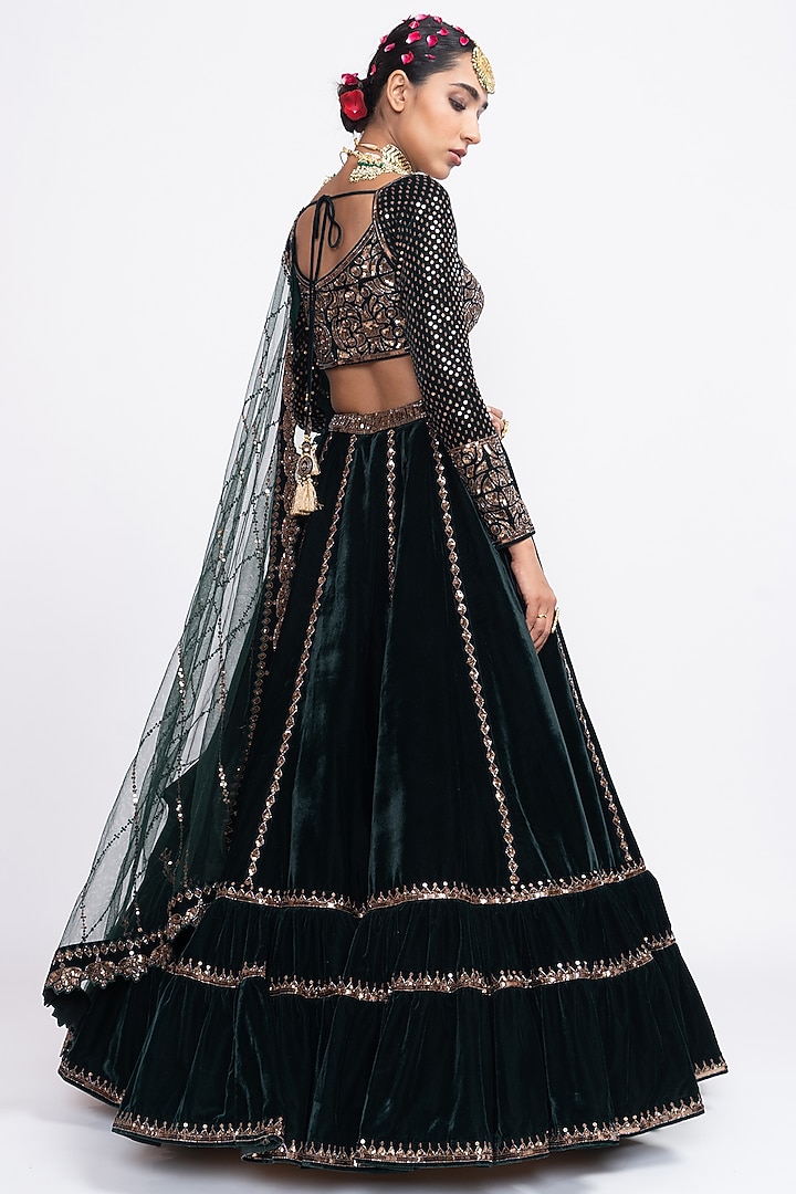 Dark Green Velvet Layered Wedding Lehenga Set by Vvani by Vani Vats at Pernia's Pop Up Shop