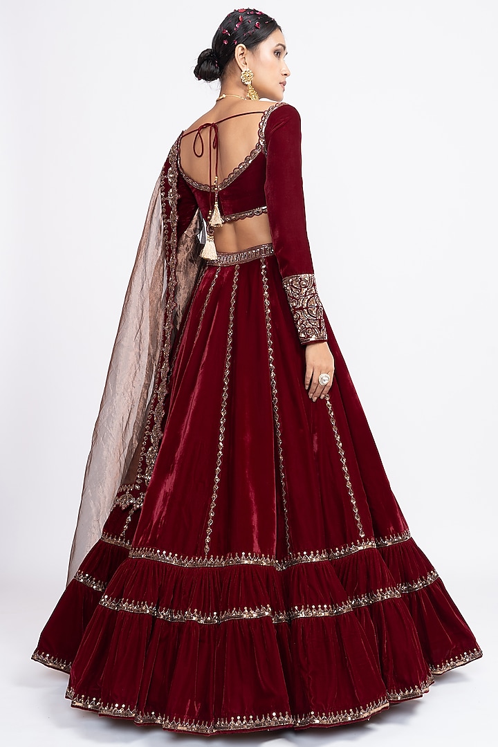 Red Velvet Hand Embroidered Tiered Wedding Lehenga Set by Vvani