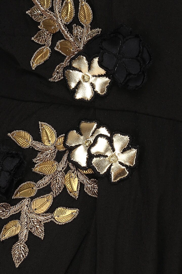 Black embroidered pleated romper available only at Pernia's Pop Up Shop.