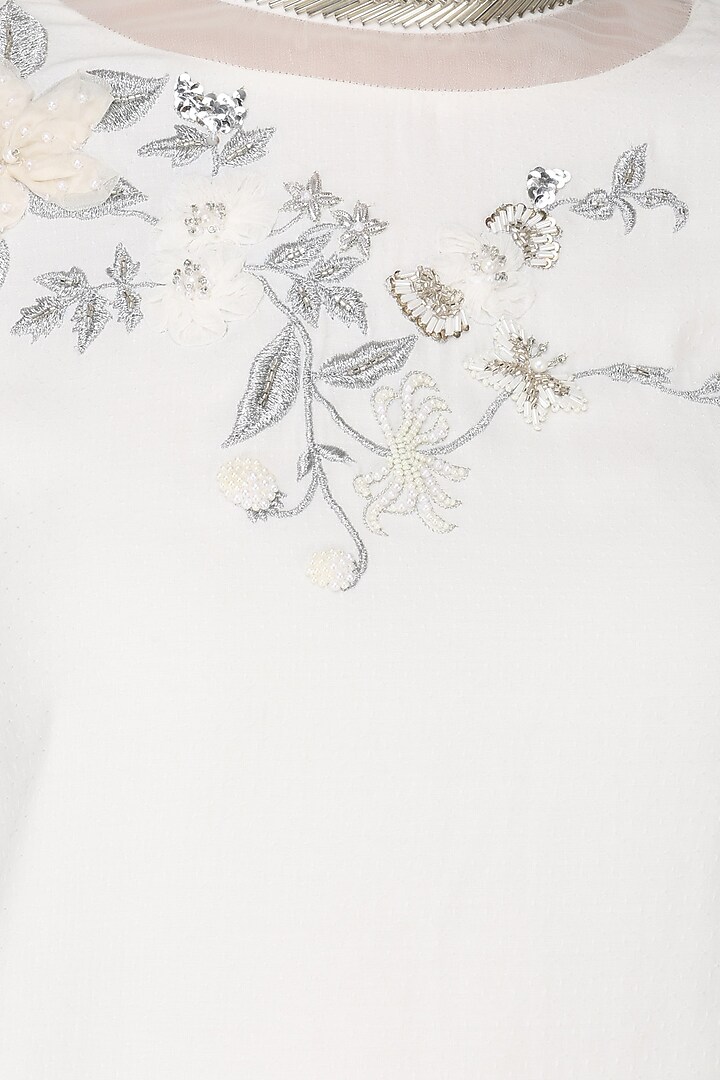 White asymmetric embroidered tunic available only at Pernia's Pop Up Shop.