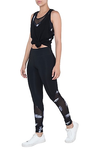Black embroidered mesh leggings by Mira rae