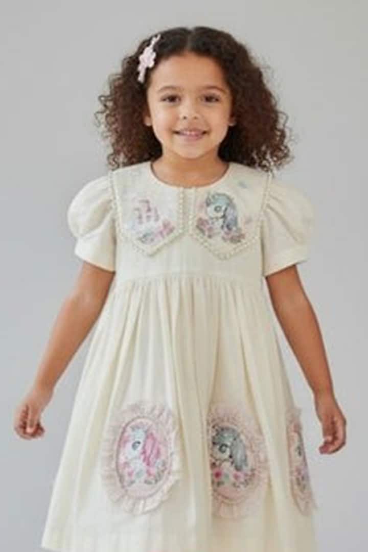 Ivory Cotton Pearl Unicorn Embroidered A-Line Dress For Girls by Pooja Wang at Pernia's Pop Up Shop