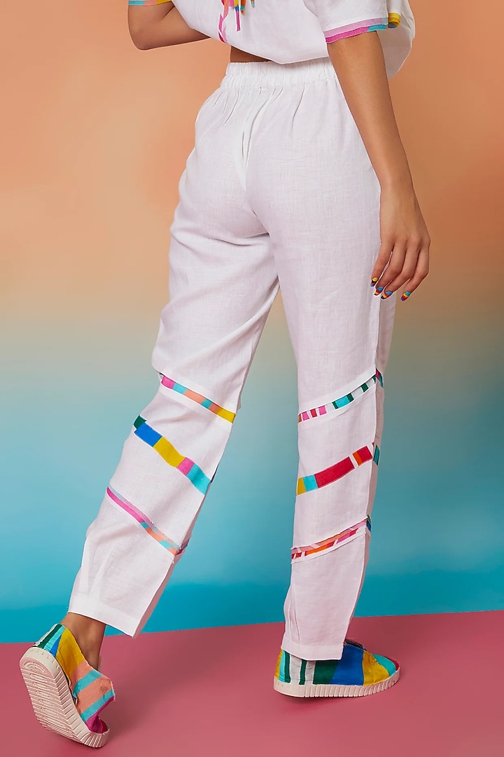White Three Striped & Pleated Jogger Pants by Wendell Rodricks at Pernia's Pop Up Shop
