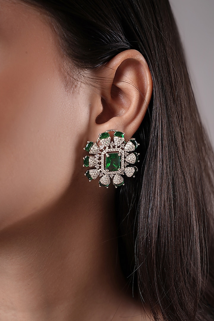 White Finish American Diamond & Green Stone Stud Earrings by XAGO at Pernia's Pop Up Shop