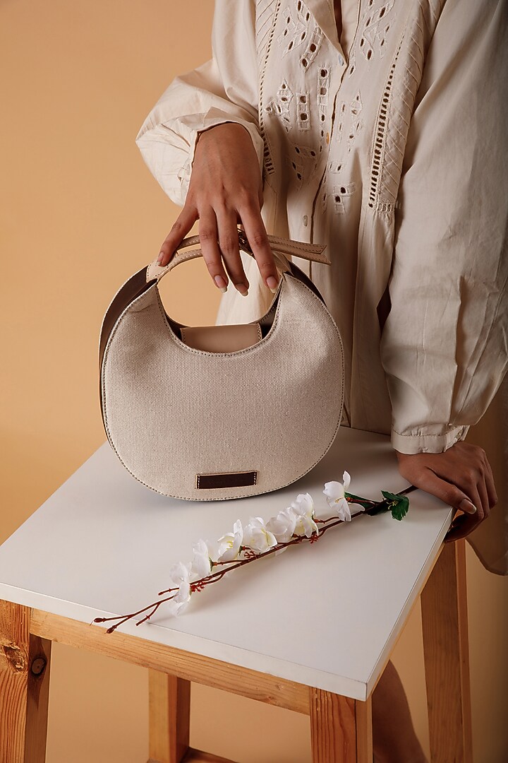 White Upcycled Leather & Canvas Hand Bag by X FEET ABOVE at Pernia's Pop Up Shop