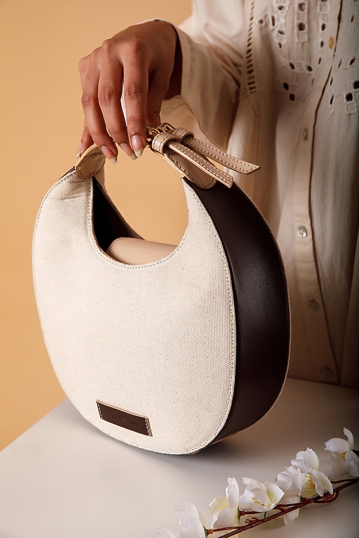 White Upcycled Leather & Canvas Hand Bag by X FEET ABOVE at Pernia's Pop Up Shop