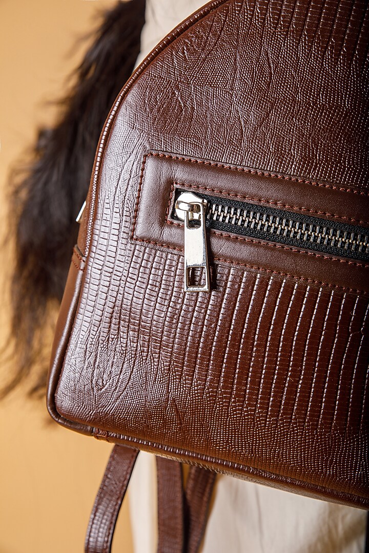 Brown Upcycled Leather Backpack by X FEET ABOVE at Pernia's Pop Up Shop