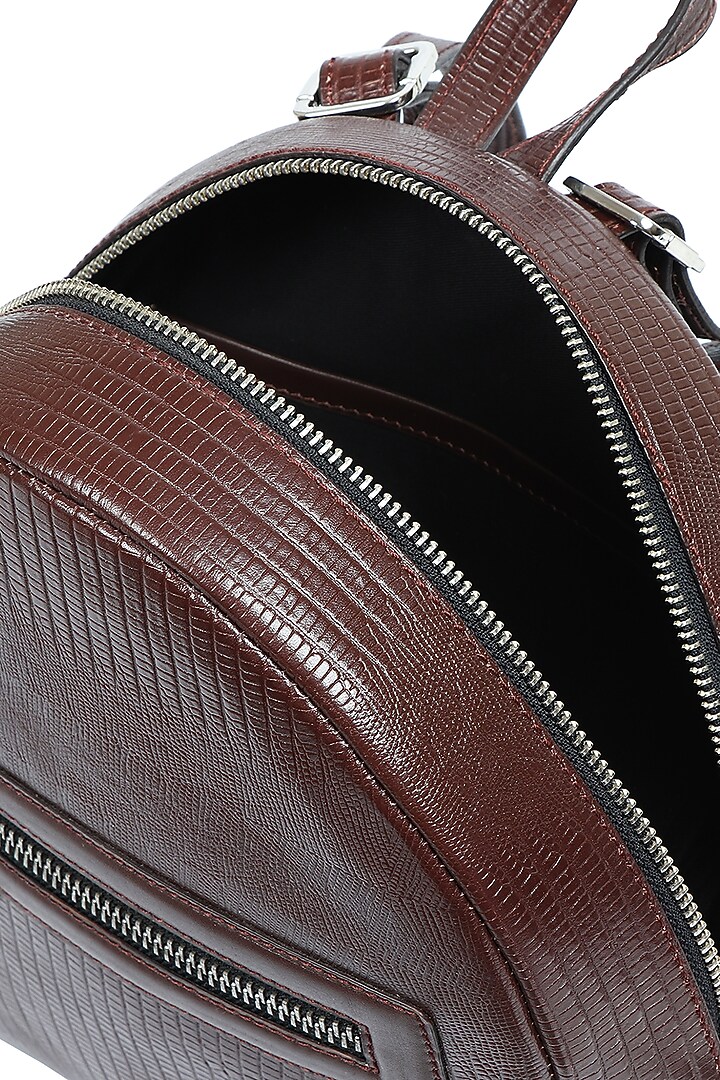 Brown Upcycled Leather Backpack by X FEET ABOVE at Pernia's Pop Up Shop