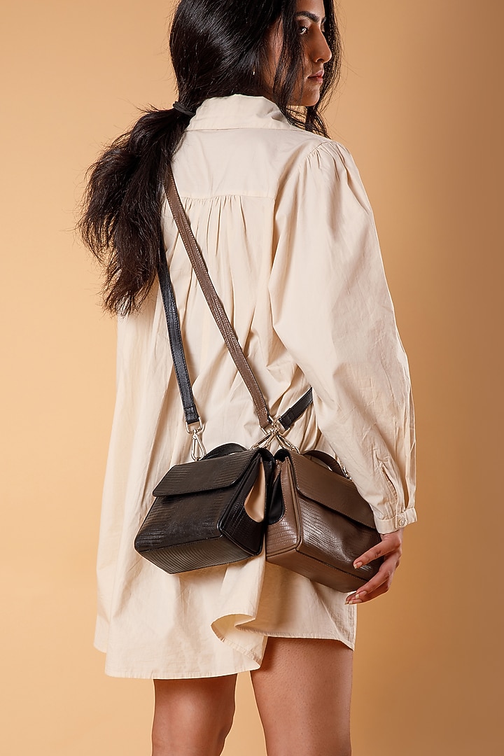 Black Full Grain Leather Crossbody Bag by X FEET ABOVE at Pernia's Pop Up Shop