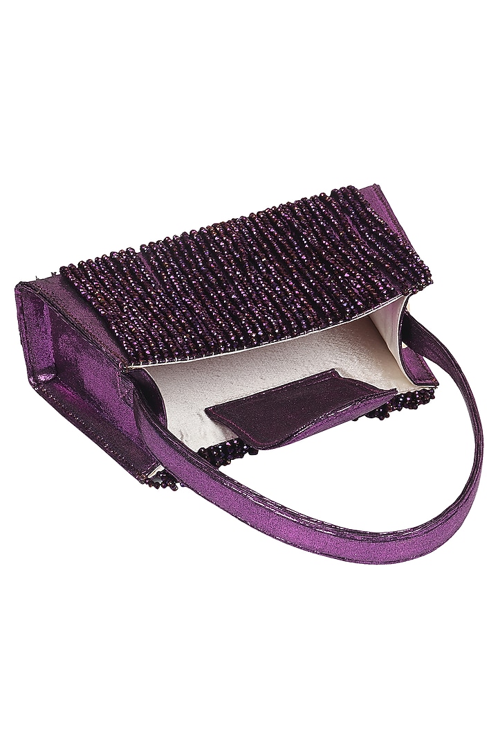 Violet Foiled Fabric Tasseled Hand Bag by X FEET ABOVE at Pernia's Pop Up Shop