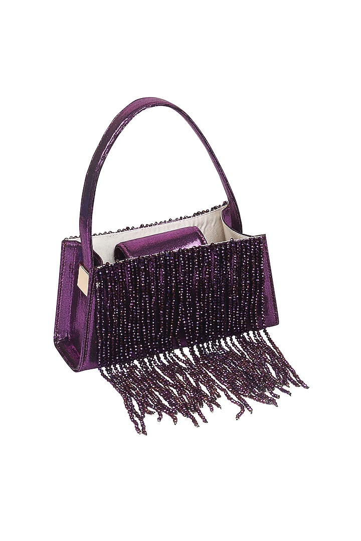 Violet Foiled Fabric Tasseled Hand Bag by X FEET ABOVE at Pernia's Pop Up Shop