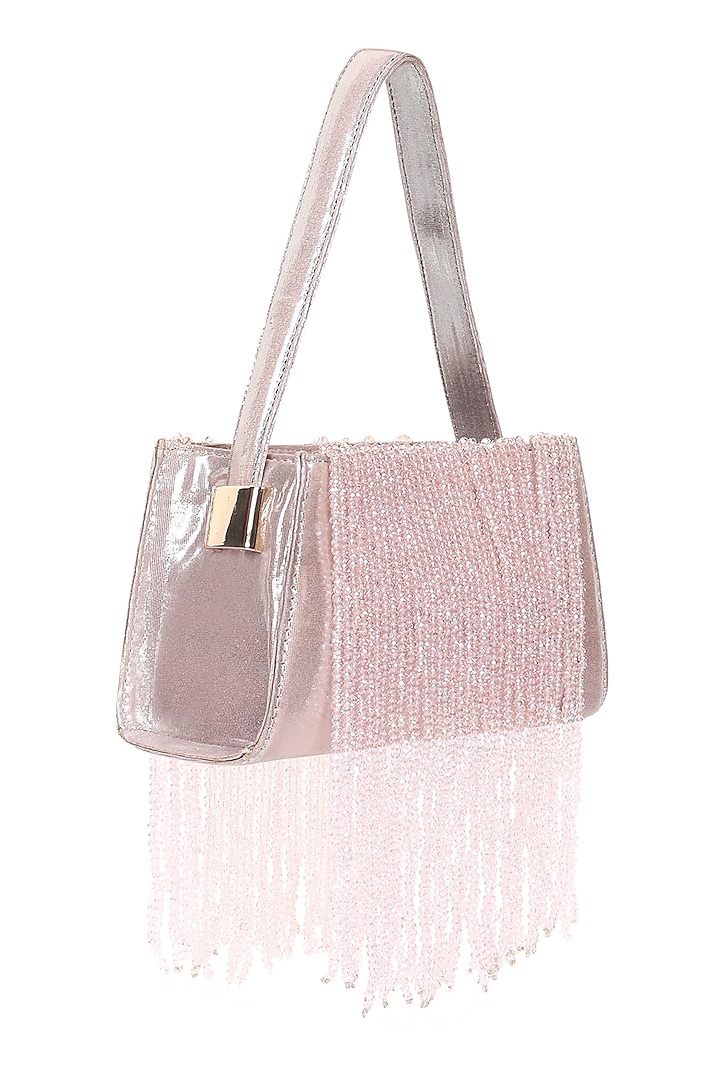 Pink Foiled Fabric Tasseled Hand Bag by X FEET ABOVE at Pernia's Pop Up Shop