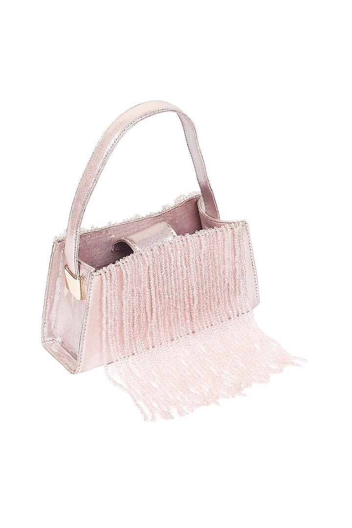 Pink Foiled Fabric Tasseled Hand Bag by X FEET ABOVE at Pernia's Pop Up Shop