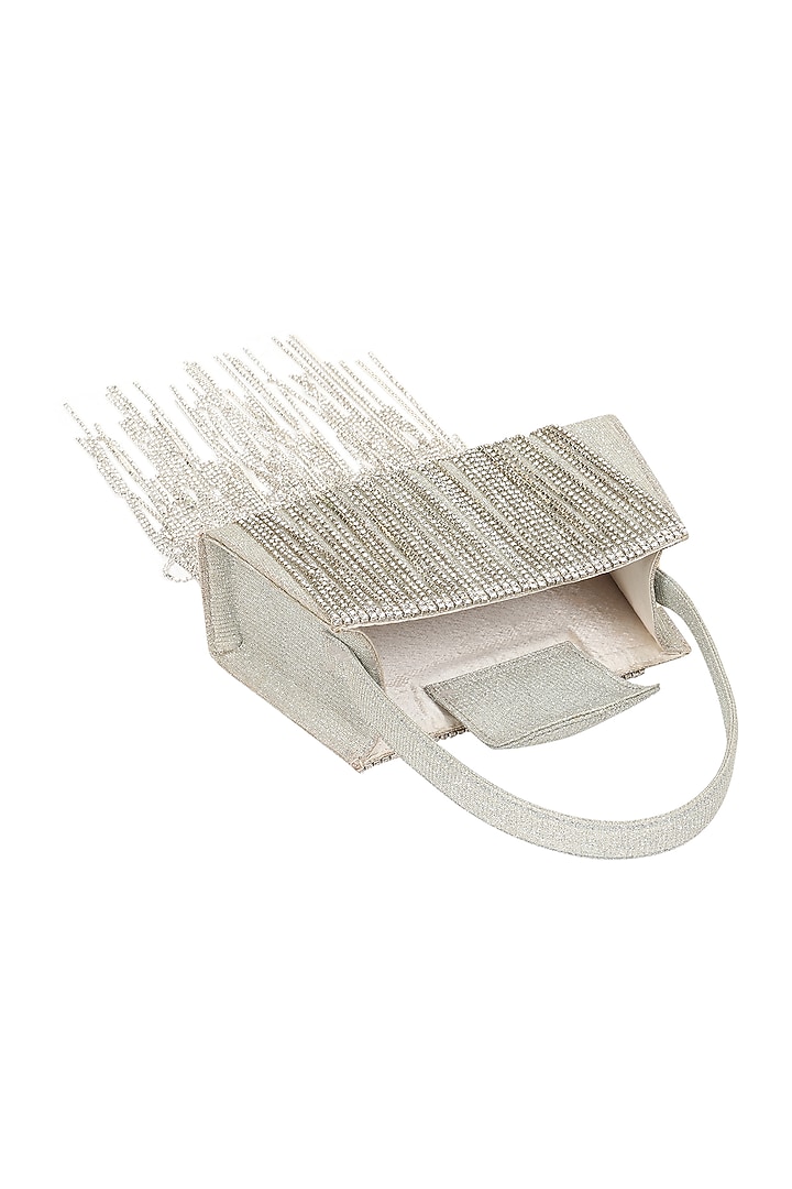 Silver Foiled Fabric Tasseled Hand Bag by X FEET ABOVE at Pernia's Pop Up Shop