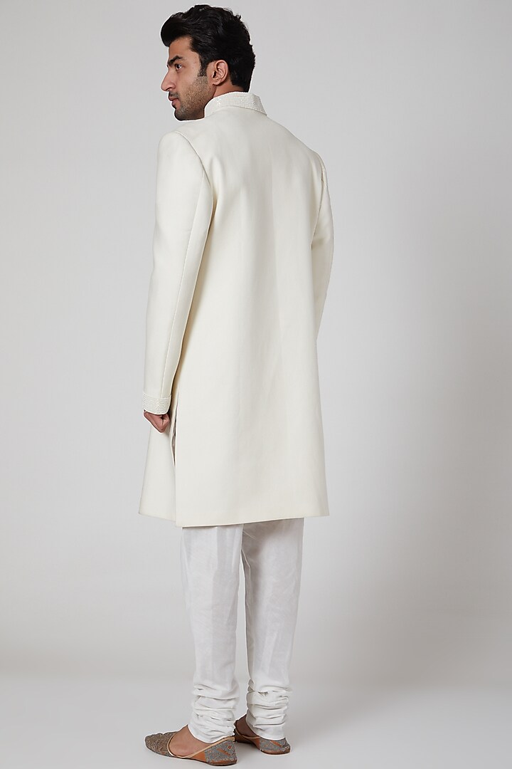 White Embroidered Asymmetric Wedding Sherwani by YAJY By Aditya Jain at Pernia's Pop Up Shop