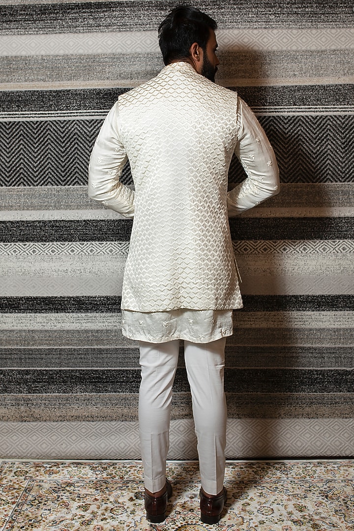 Off White Asymmetrical Kurta Set With Embroidered Open Jacket by YAJY By Aditya Jain at Pernia's Pop Up Shop