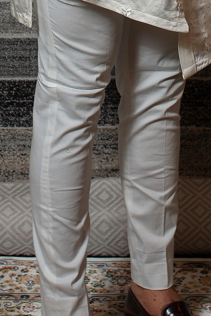 Off White Asymmetrical Kurta Set With Embroidered Open Jacket by YAJY By Aditya Jain at Pernia's Pop Up Shop