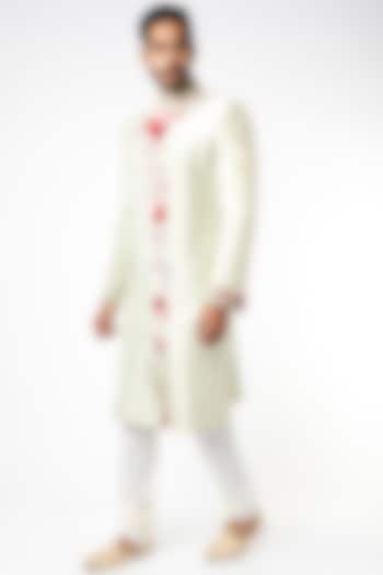 Mint Green Raw Silk Floral Embroidered Wedding Sherwani Set by YAJY By Aditya Jain at Pernia's Pop Up Shop