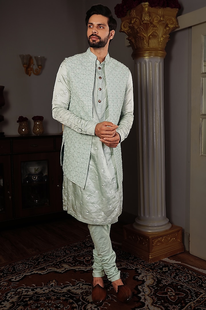 Aqua Green Silk Bundi Jacket With Motifs by YAJY By Aditya Jain