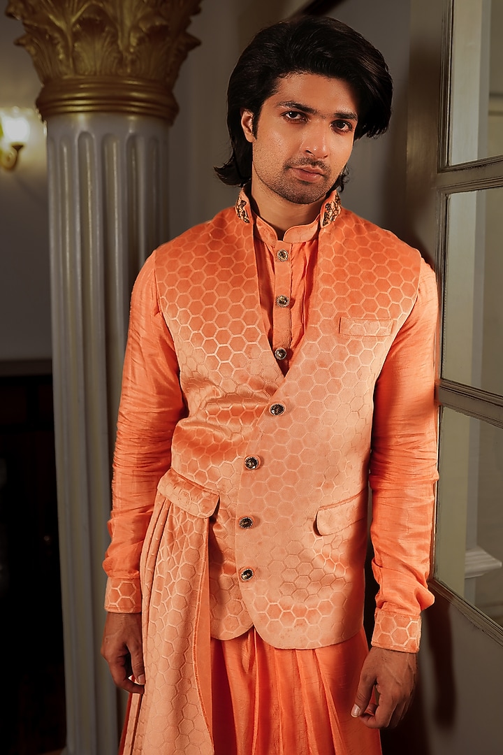 Orange Silk Neo Printed & Embroidered Pleated Bundi Jacket by YAJY By Aditya Jain at Pernia's Pop Up Shop