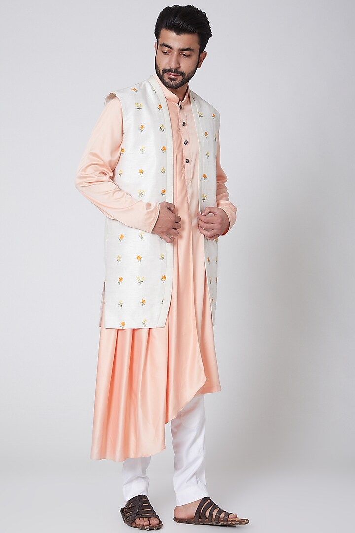 Peach Asymmetric Kurta With White Embroidered Jacket by YAJY By Aditya Jain