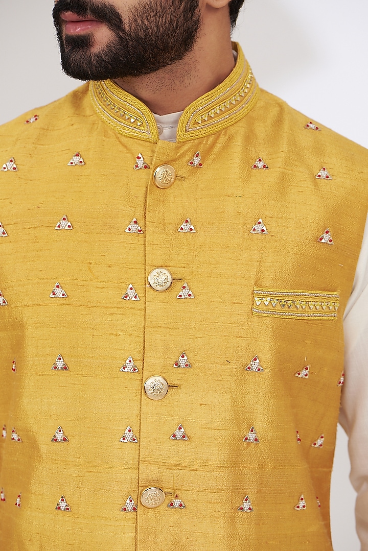 Mustard Yellow Raw Silk Embroidered Nehru Jacket by Yashodhara Men at Pernia's Pop Up Shop