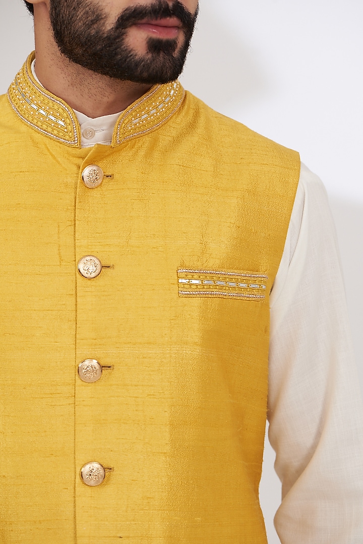 Mustard Yellow Raw Silk Embroidered Nehru Jacket by Yashodhara Men at Pernia's Pop Up Shop