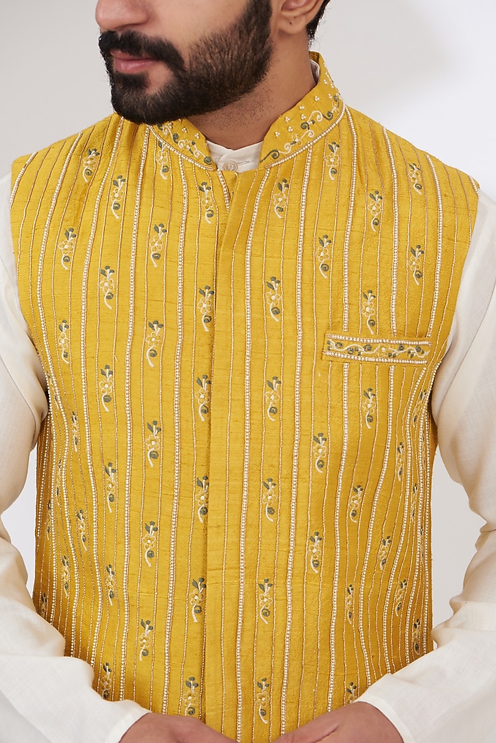 Mustard Yellow Raw Silk Embroidered Nehru Jacket by Yashodhara Men at Pernia's Pop Up Shop