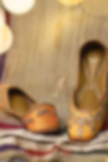 Yellow Raw Silk Cutdana & Sequins Embroidered Juttis by YASSIO at Pernia's Pop Up Shop
