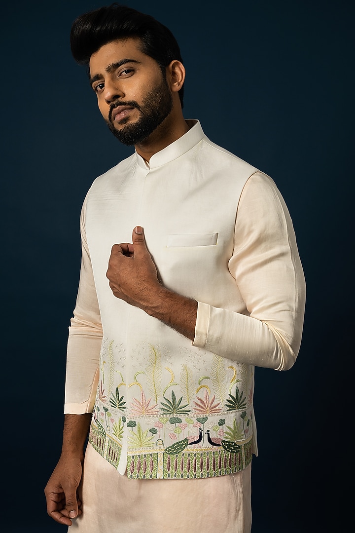 Ivory Linen Satin Embroidered Nehru Jacket by YOSEBA at Pernia's Pop Up Shop