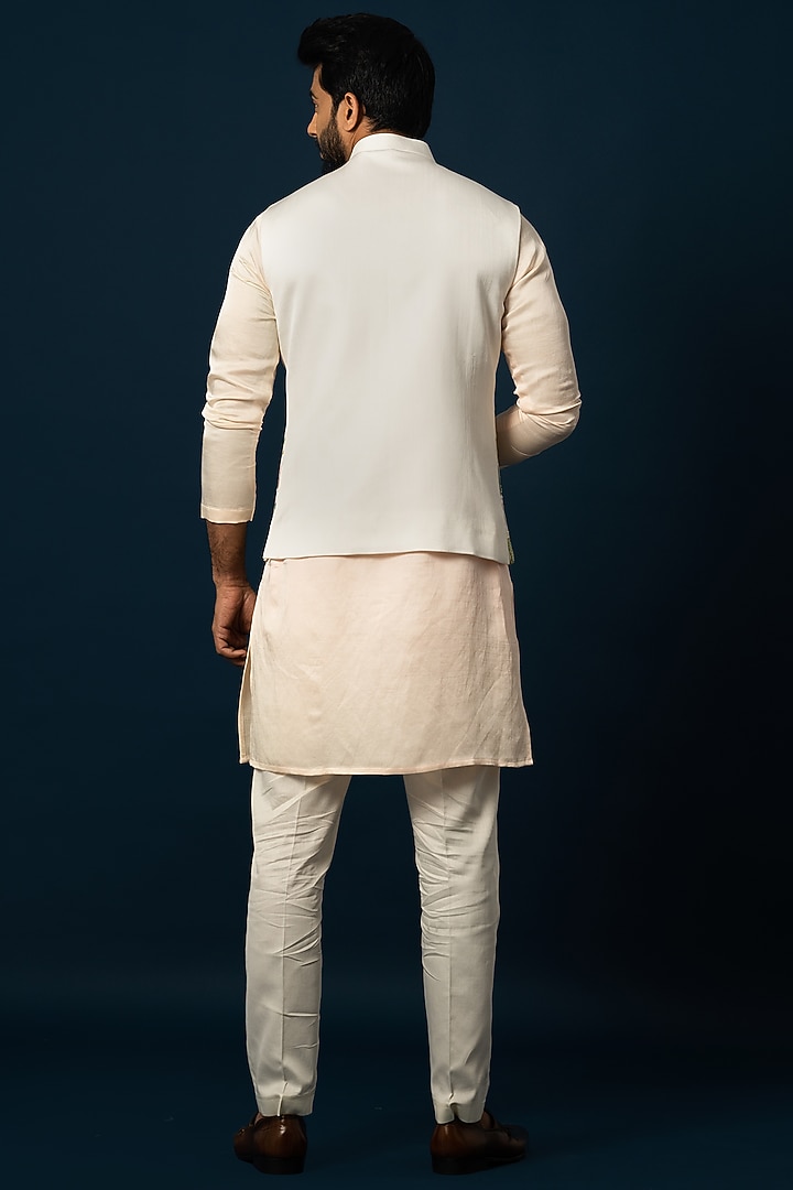 Ivory Linen Satin Embroidered Nehru Jacket by YOSEBA at Pernia's Pop Up Shop
