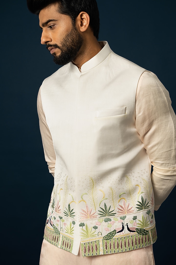 Ivory Linen Satin Embroidered Nehru Jacket by YOSEBA at Pernia's Pop Up Shop