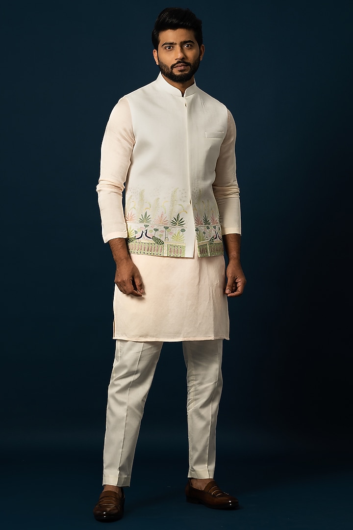 Ivory Linen Satin Embroidered Nehru Jacket by YOSEBA at Pernia's Pop Up Shop