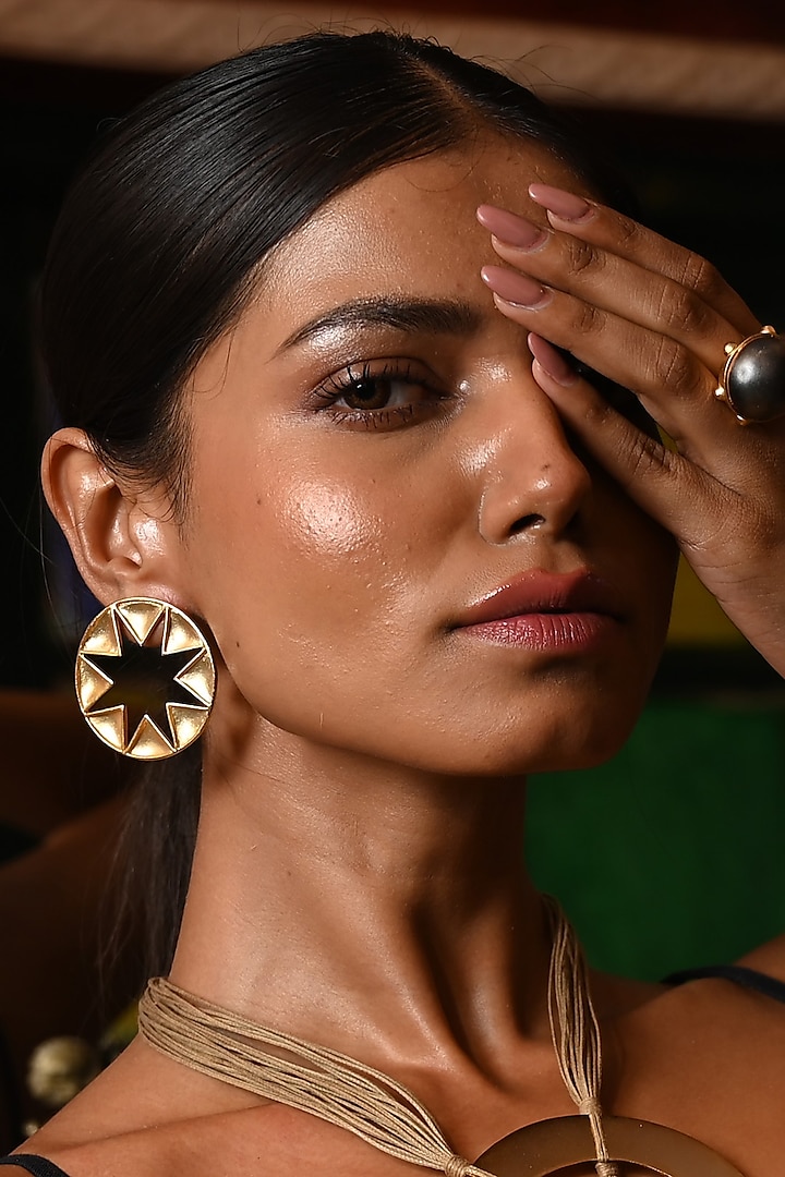 Gold Finish Star-Shaped Cut-Out Stud Earrings by ZAZA BY SOMYA at Pernia's Pop Up Shop