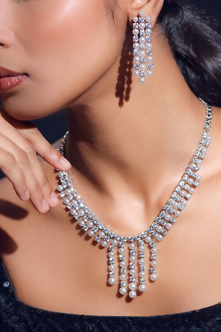 White Finish Pearl & Zircon Necklace Set by ZAZA BY SOMYA at Pernia's Pop Up Shop