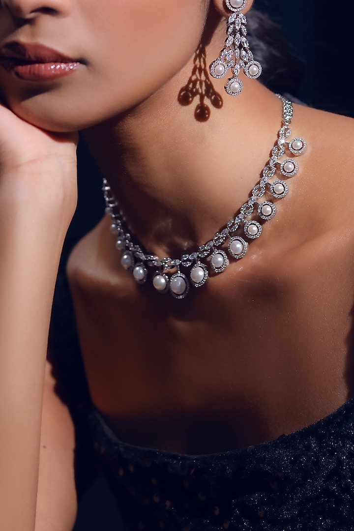White Finish Pearl & Zircon Necklace Set by ZAZA BY SOMYA at Pernia's Pop Up Shop