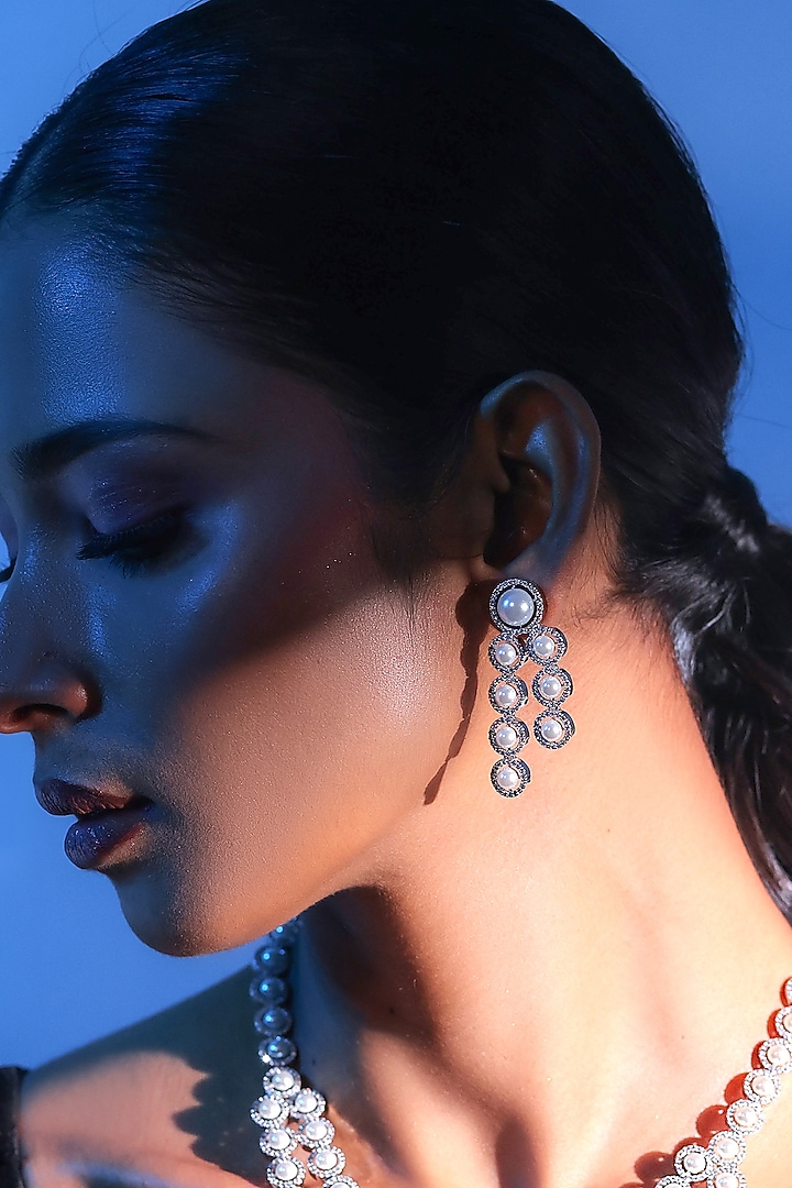 White Finish Zircon & Pearl Dangler Earrings by ZAZA BY SOMYA at Pernia's Pop Up Shop