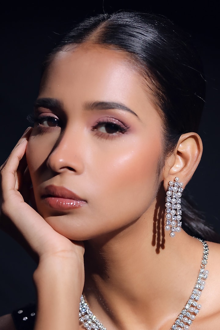 White Finish Pearl & Zircon Dangler Earrings by ZAZA BY SOMYA at Pernia's Pop Up Shop