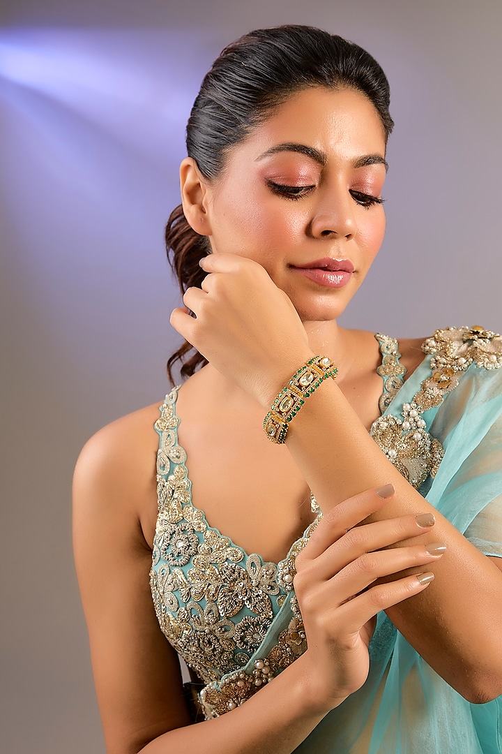 Gold Finish Moissanite Polki & Green Stone Kada by Zevar By Geeta at Pernia's Pop Up Shop