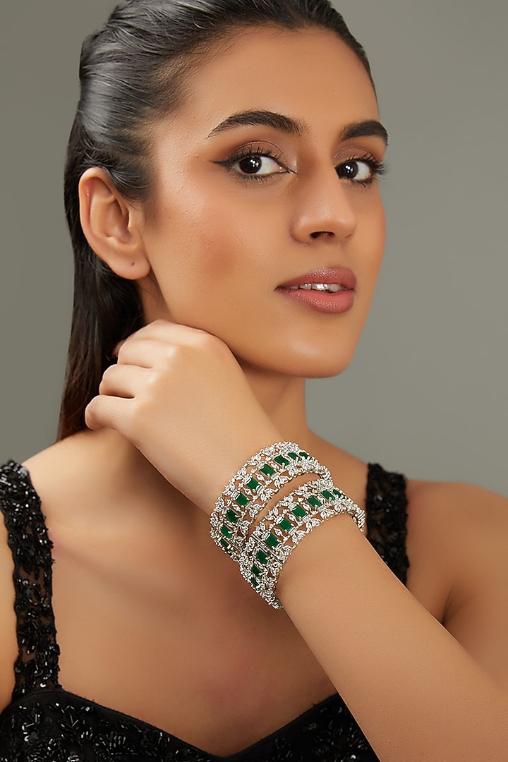 White Finish Faux Diamond & Green Stone Bangles (Set of 2) by Zevar By Geeta at Pernia's Pop Up Shop