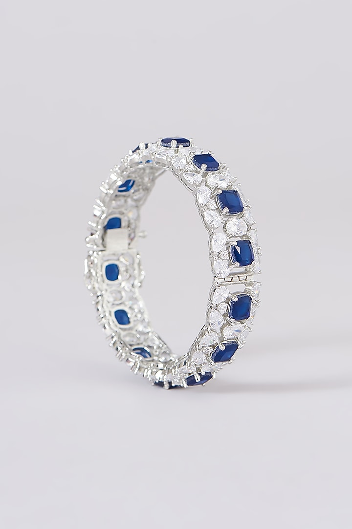 White Finish Faux Diamond & Sapphire Stone Bangles (Set of 2) by Zevar By Geeta at Pernia's Pop Up Shop