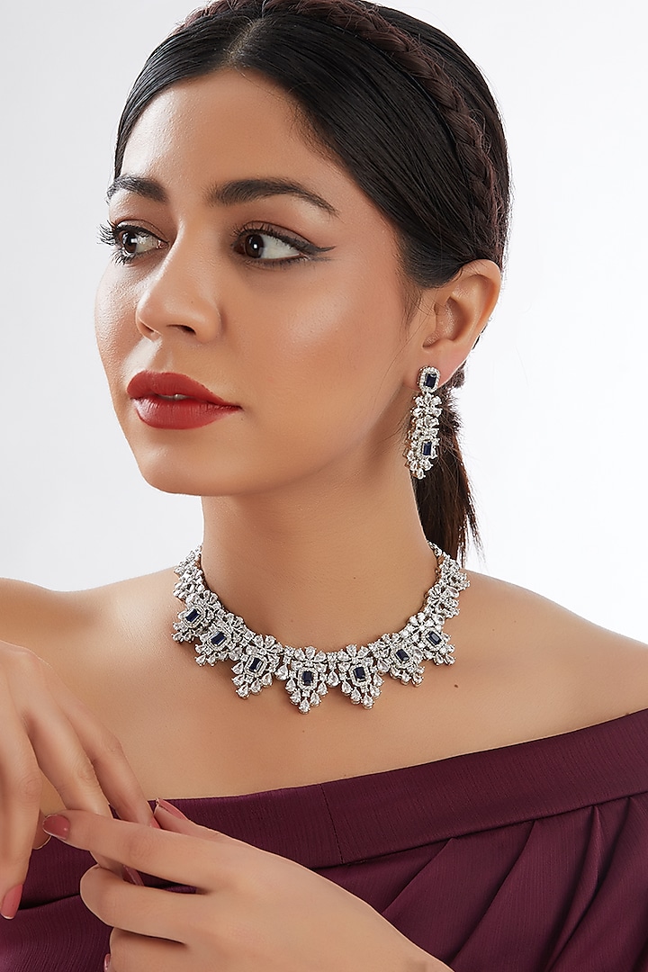 White Finish Faux Diamond & Blue Stone Necklace Set by Zevar by Geeta