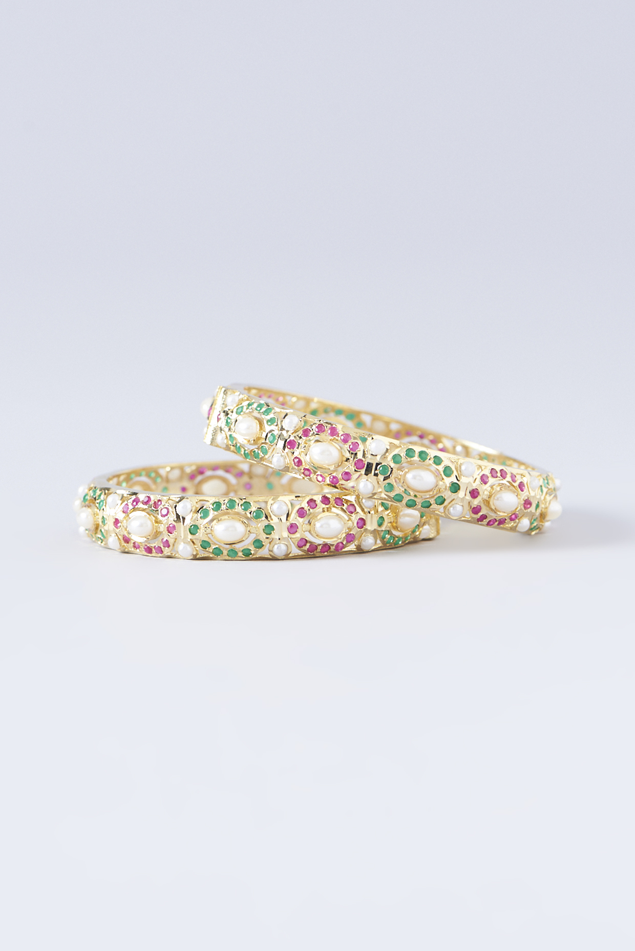 Gold Finish Ruby & Emerald Kada (Set Of 2) by Zevar by Geeta