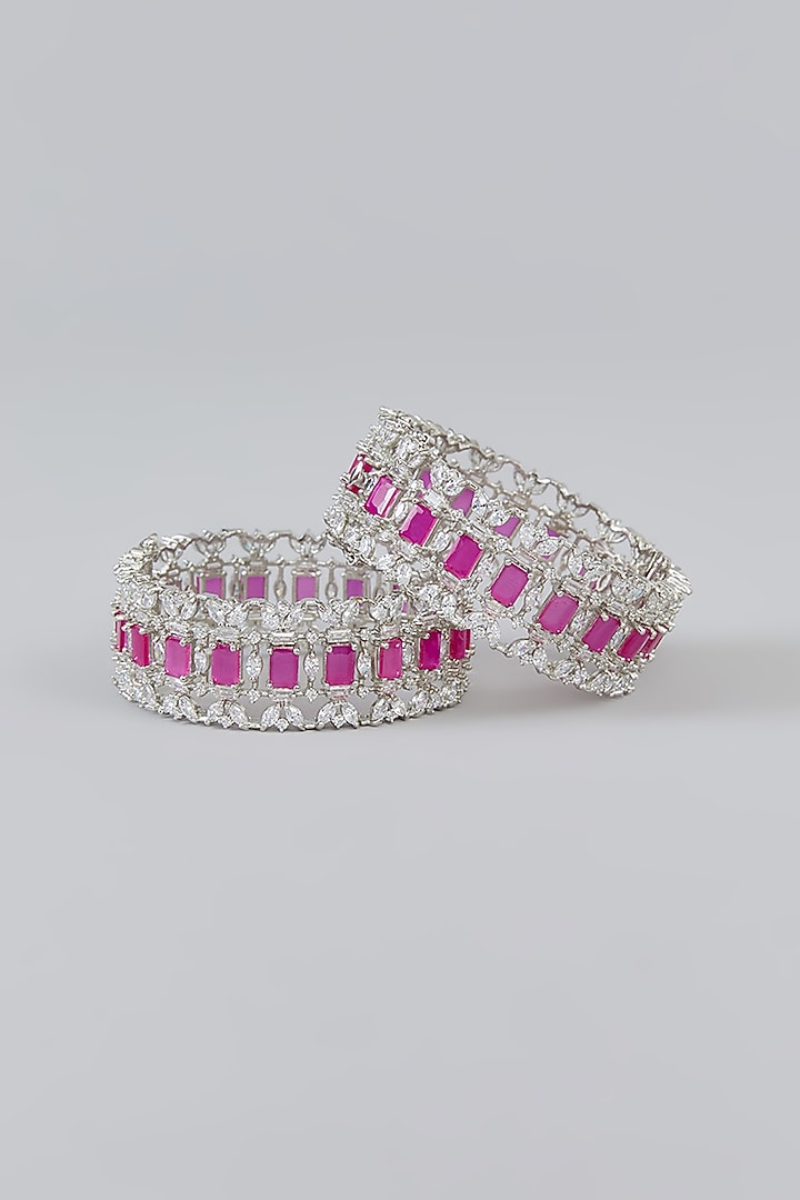 White Finish Faux Diamond & Pink Stone Bangles (Set of 2) by Zevar By Geeta at Pernia's Pop Up Shop