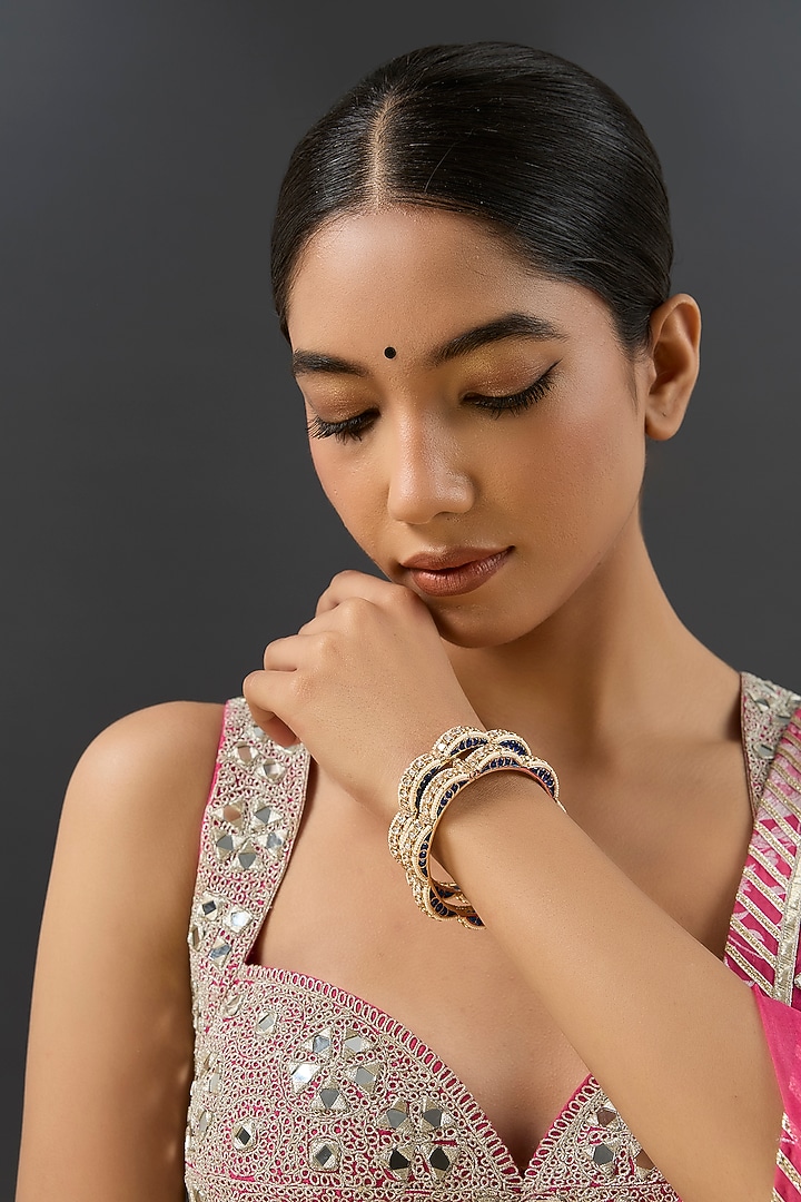 Gold Finish Kundan Polki & Blue Resin Openable Bangles by Zevar By Geeta at Pernia's Pop Up Shop