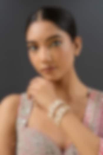 Gold Finish Kundan Polki & Red Stone Bangles (Set Of 2) by Zevar by Geeta at Pernia's Pop Up Shop