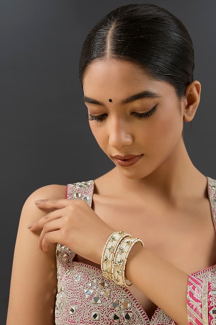 Gold Finish Kundan Polki & Pearl Kadas (Set Of 2) by Zevar By Geeta at Pernia's Pop Up Shop