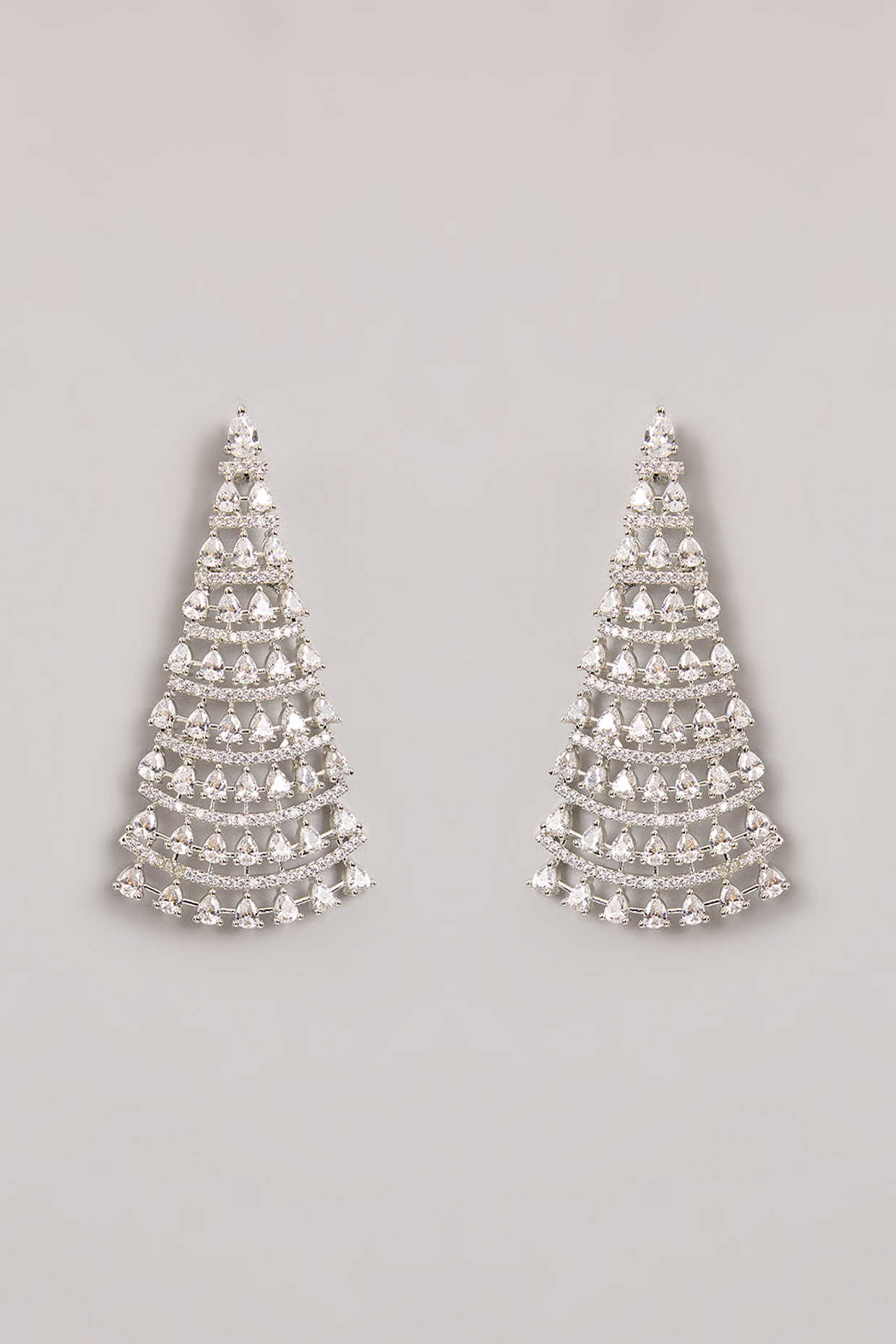 White Finish Diamond Dangler Earrings by Zevar By Geeta at Pernia's Pop Up Shop