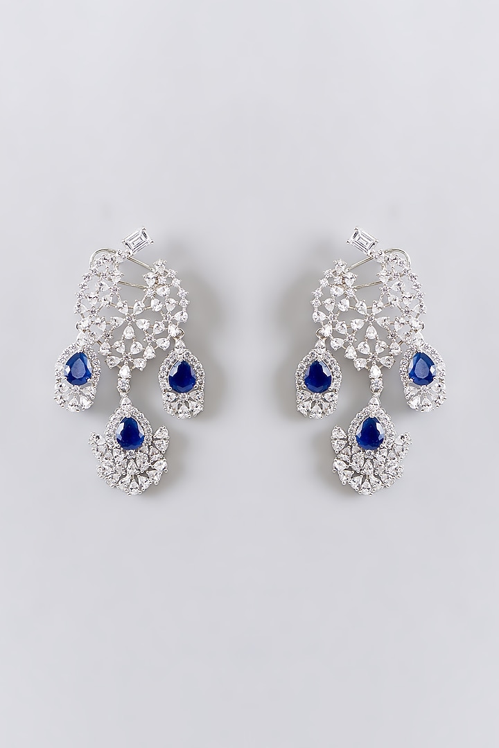 White Finish Synthetic Sapphire Dangler Earrings by Zevar By Geeta at Pernia's Pop Up Shop