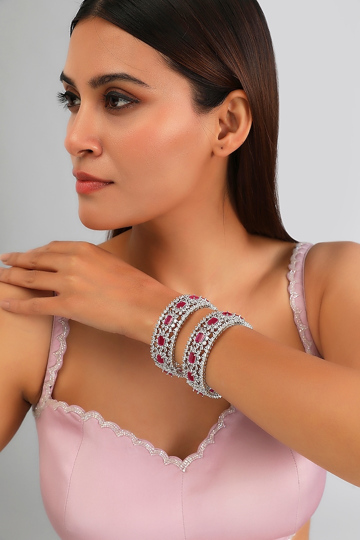 White Finish Diamond & Pink Stone Bangles (Set of 2) by Zevar By Geeta at Pernia's Pop Up Shop